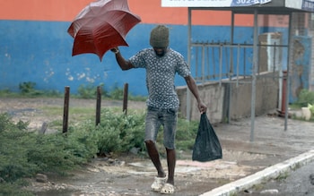 A man in Jamaica hurried home through the wind and the rain before Hurricane Beryl battered the island